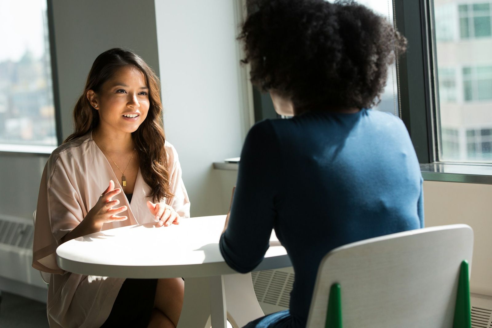 A clinician meeting one-on-one with a resident